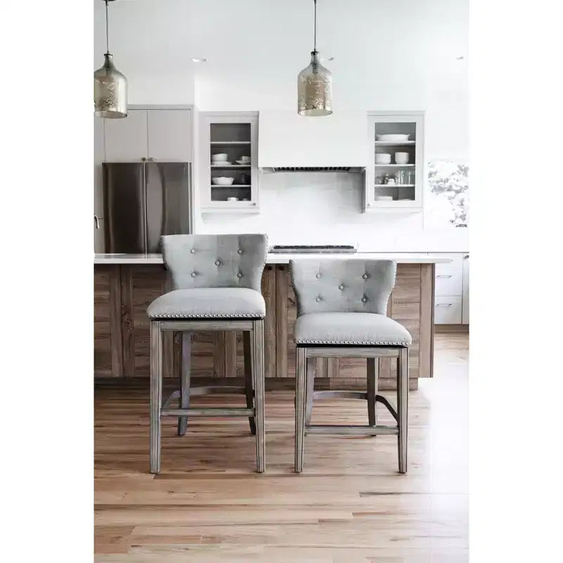Sgabello da bar alto in tessuto Wingback