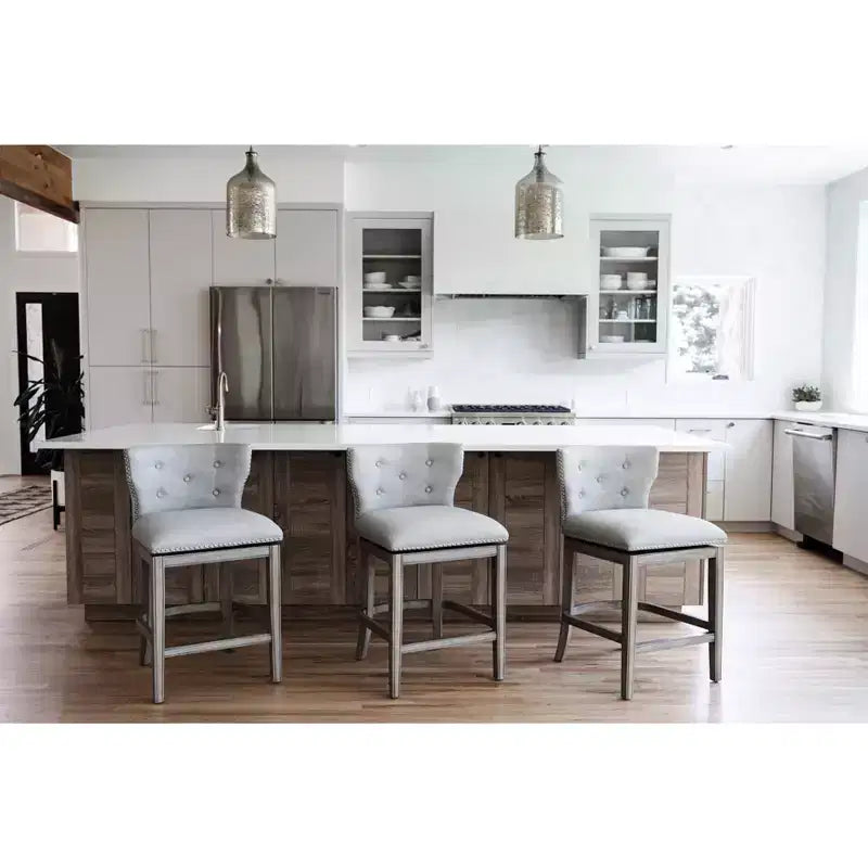 Sgabello da bar alto in tessuto Wingback