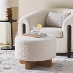 Pouf rotondo in finto montone con base in legno di caucciù
