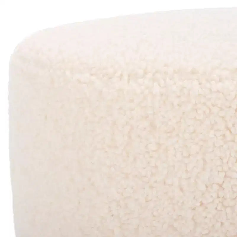 Pouf rotondo in finto montone con base in legno di caucciù