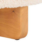 Pouf rotondo in finto montone con base in legno di caucciù