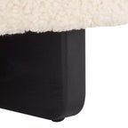 Pouf rotondo in finto montone con base in legno di caucciù